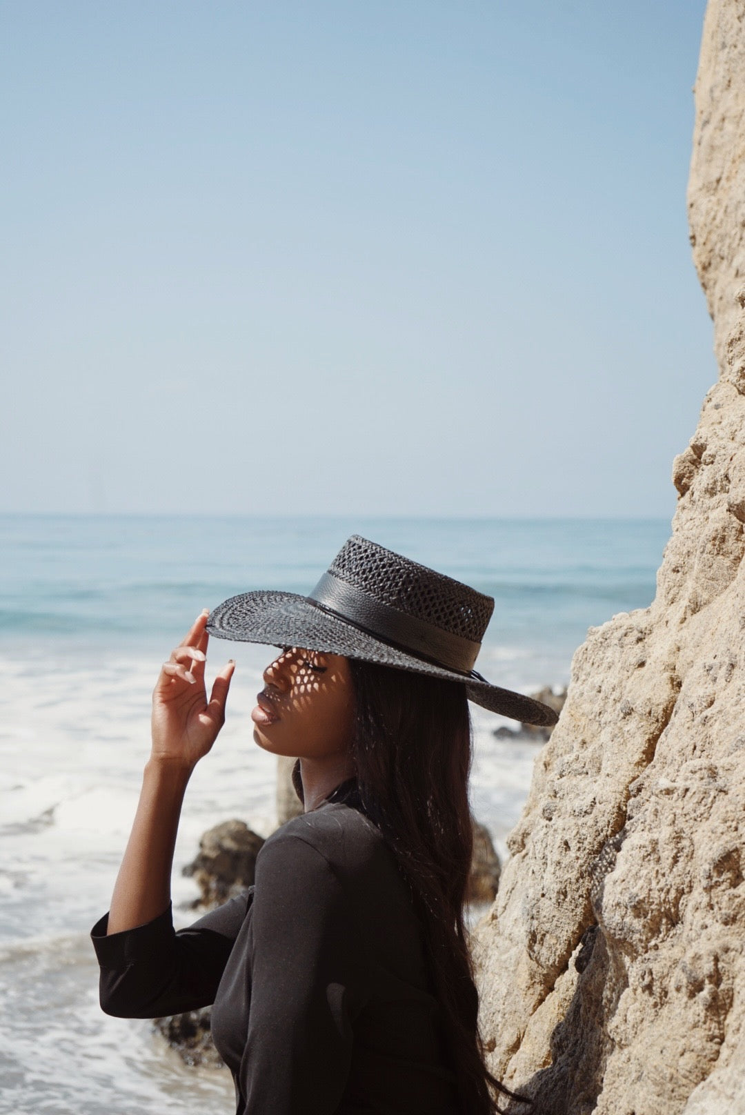 Women-in-black-straw-hat-cord-knotted